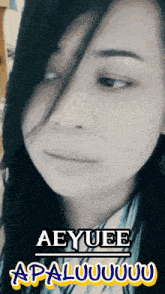 a close up of a woman 's face with the words aeyuee apaluuuu on the bottom right