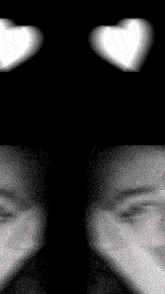a black and white photo of a person 's eyes and hearts