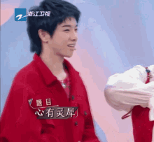 a man in a red jacket with chinese writing on the front
