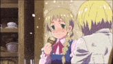 a boy and a girl are standing next to each other and the girl is holding something in her hand