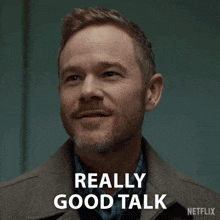 a man with a beard says " really good talk " in white letters