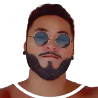 a man with a beard wearing sunglasses and piercings