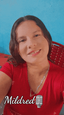 a woman in a red shirt with the name mildred on the bottom right