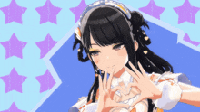 a girl making a heart with her hands on her chest