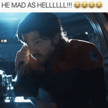a man talking into a microphone with the words he mad as hell on the bottom