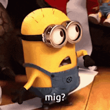 a minion wearing goggles and overalls is asking mig