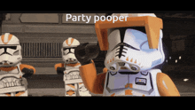 a lego storm trooper says party pooper in front of two other storm trooper figures