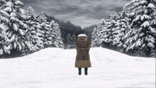 a person standing in the middle of a snowy forest with a backpack on their back