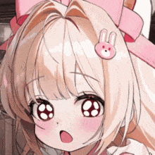 a close up of a girl with a pink bunny hair clip