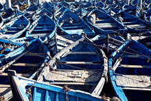 a bunch of blue boats one of which has the word harval on the side
