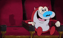 a group of people sitting in a theater watching a cartoon
