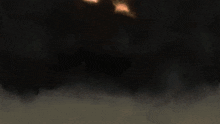 a lightning bolt strikes the ground in the middle of a storm