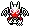 a pixel art drawing of a dragon with wings and a red star on its head .