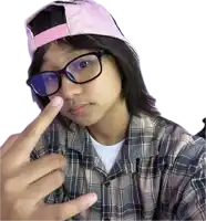 a girl wearing glasses and a plaid shirt is making a selfie