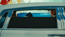 a painting of a shark in the window of a car