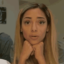 a woman with a surprised look on her face is asking what the heck