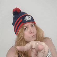 a woman wearing a blue and red hat that says nous sommes l' olympique d' orage