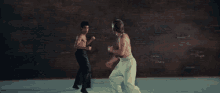 Bruce Lee Chuck Norris GIF - Bruce Lee Chuck Norris Epic Fight GIFs