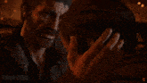 a man is kissing a woman on the forehead in a video game scene