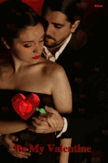 a man and a woman are hugging with a heart in the background and the words vice written on the bottom