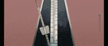 a metronome with a pink background and chinese writing
