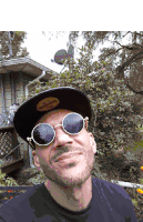 a man wearing sunglasses and a hat with a sticker that says ' abercrombie & fitch '