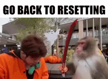 a man is standing next to a monkey holding a sword in front of a building .