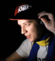 a man wearing headphones and a hat that says obf