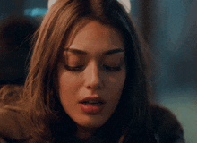a woman with a serious look on her face
