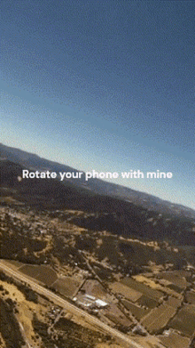 an aerial view of a landscape with the words rotate your phone with mine