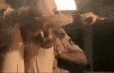 a man in a police uniform is holding a gun and pointing it at someone .