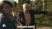 a man and a woman standing next to each other with the man saying skatowal mnie !!!