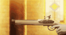 a person is holding a gun in their hand in front of a wall .