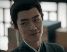 a close up of a man 's face wearing a suit and tie