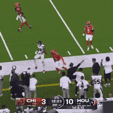 a football game is being played between the chi and the hou teams