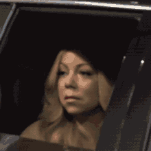 a close up of a woman 's face with a shadow on her face