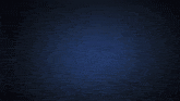 a blue glowing object in the dark with a black background