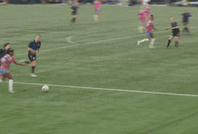 a soccer game is being played on a field sponsored by alt hotels and roses