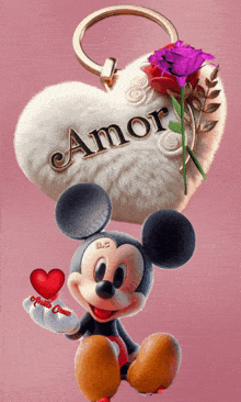 a picture of mickey mouse holding a heart with the word amor on it