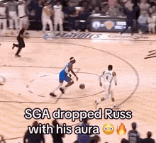 a basketball game is being played on a court with the words sga dropped russ with his aura