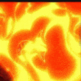 a red and yellow background with a flame coming out of the center