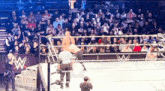 a wrestling ring with a large w on the side
