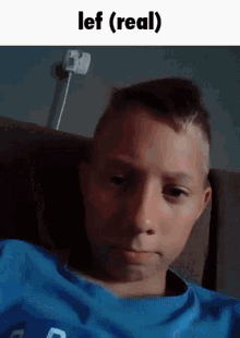 a young boy in a blue shirt is sitting on a couch with the words lef ( real ) above him