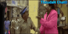 a blurred image of a woman in a pink jacket talking to a man in a police uniform