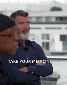 a man with a beard is talking to another man with the words take your medicine written on the bottom