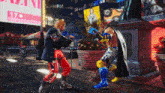 two fighters are fighting in front of a sign that says may 17th