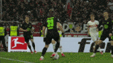a soccer player with the number 39 on his back kicks the ball