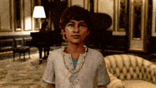 a boy with a necklace around his neck is standing in a room