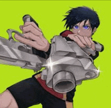 a boy is holding a gun in his hand .