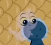 a cartoon character wearing sunglasses is standing in front of a wall .